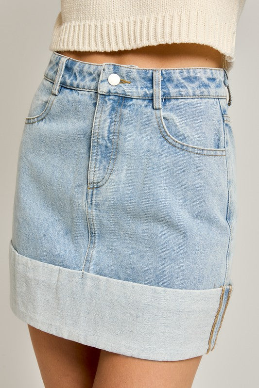 Light wash denim mini skirt with cuffed hem.