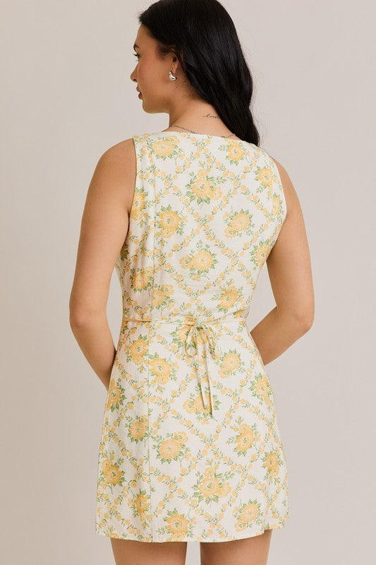 Woman in yellow floral dress.