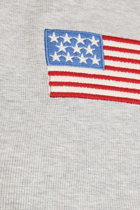 Gray fabric with embroidered American flag.