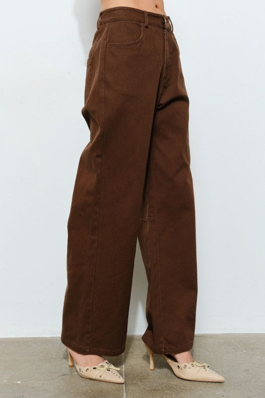 Brown wide-leg pants worn by a person on a white background