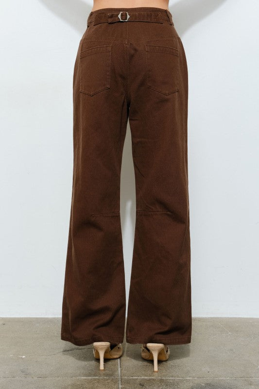 Brown flared pants on a plain white background