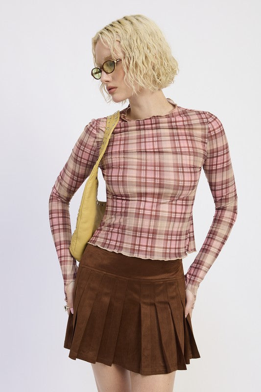 Woman wearing a plaid shirt and brown skirt with a yellow bag on a white background