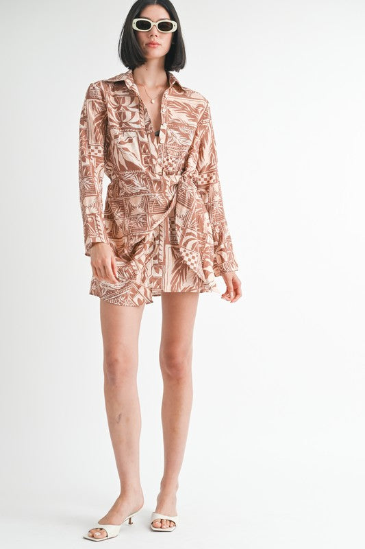 Woman wearing a patterned dress on a white background