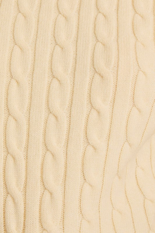 Close-up of a beige fabric with a subtle wave pattern