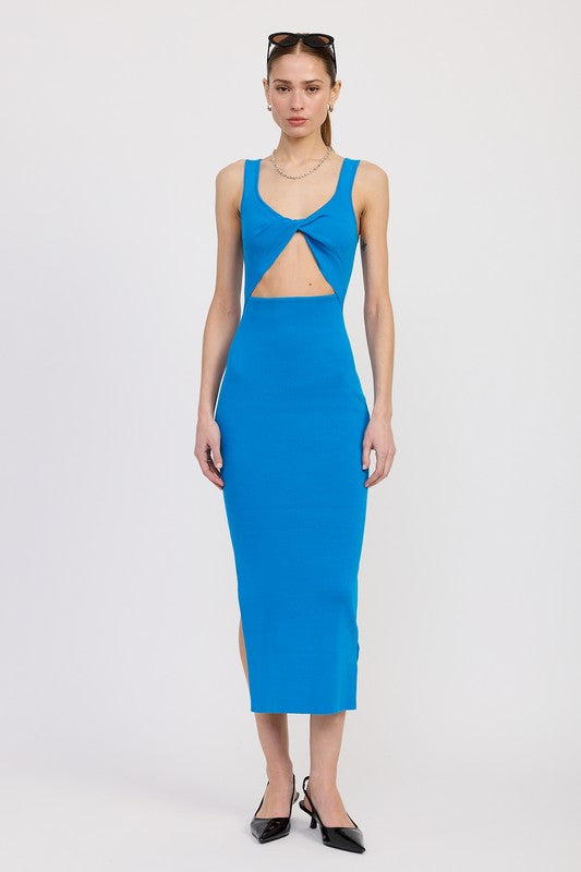 Woman wearing a blue dress with cut-out design on a white background