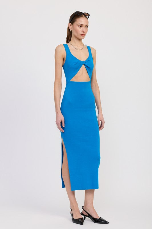 Model wearing a blue dress with cut-out design on a white background