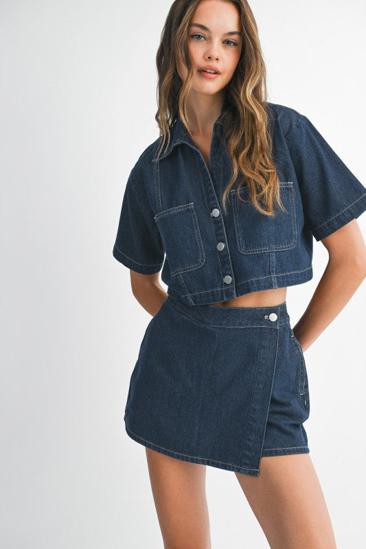 Woman wearing a denim outfit on a white background