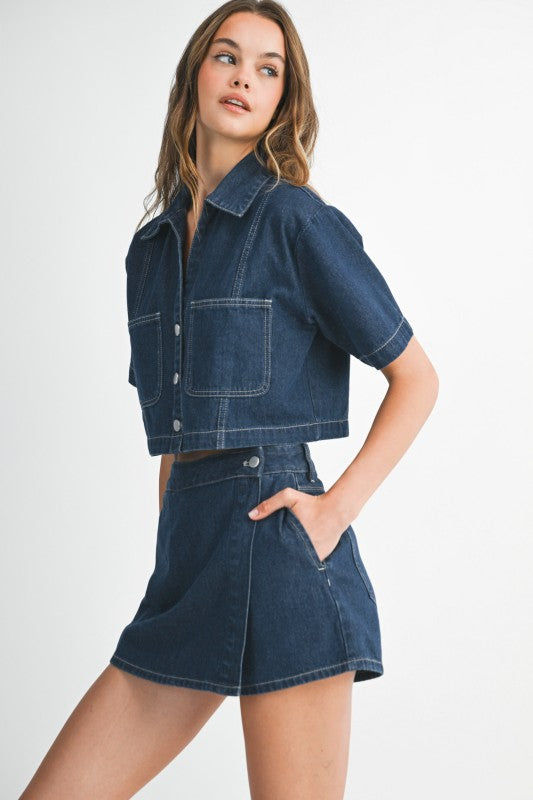 Woman wearing a denim outfit on a white background