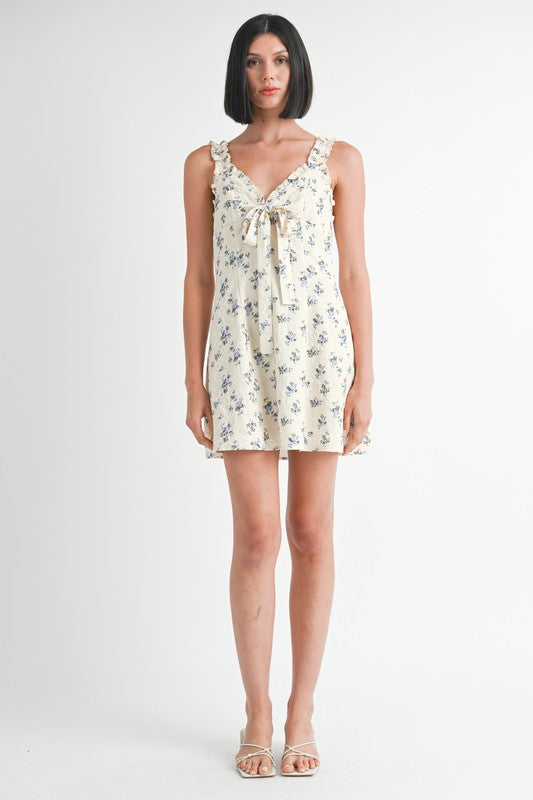 Woman wearing a floral dress on a white background