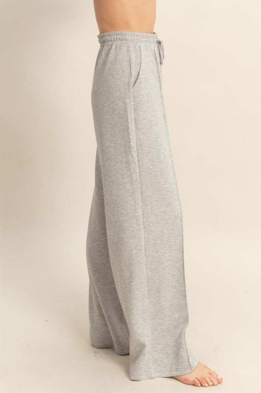 Gray wide-leg pants on a plain background
