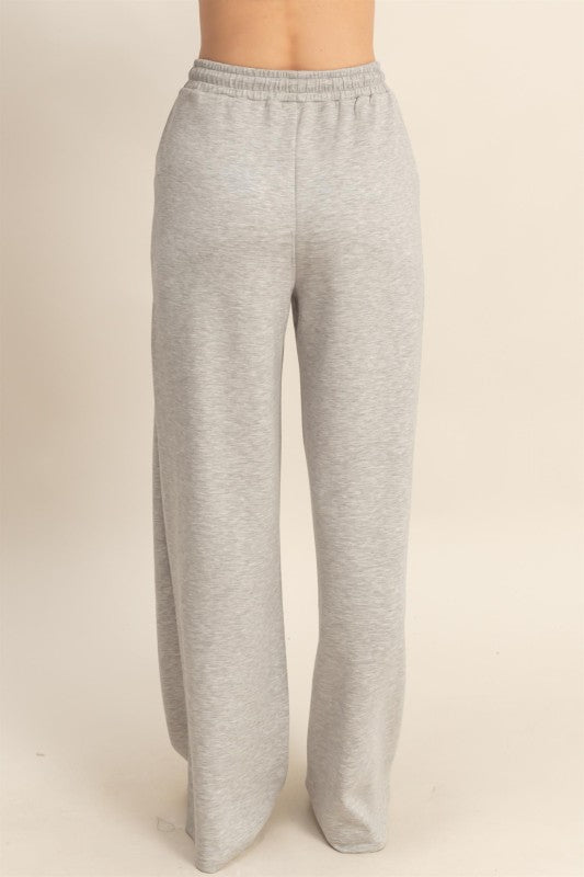 Gray sweatpants on a beige background