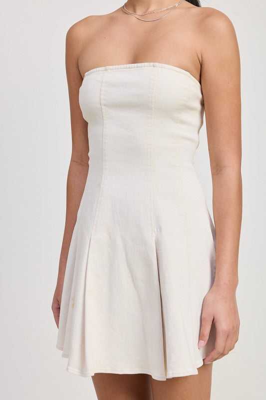White strapless dress worn by a person on a white background