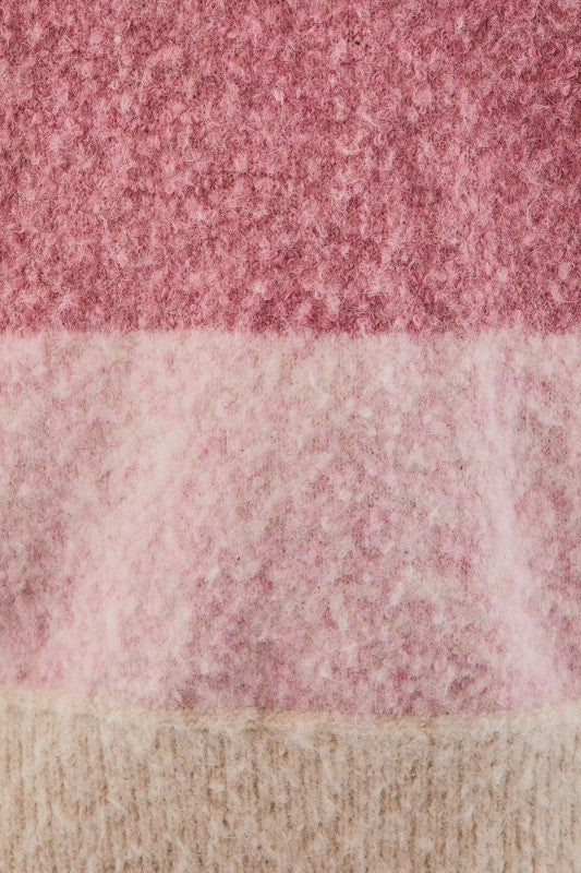Close-up of a pink and beige textured fabric