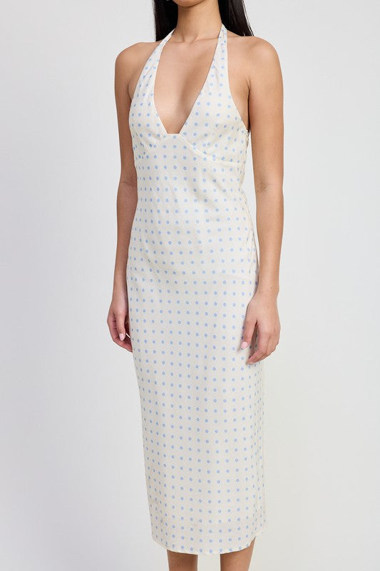 White sleeveless dress with a pattern on a white background
