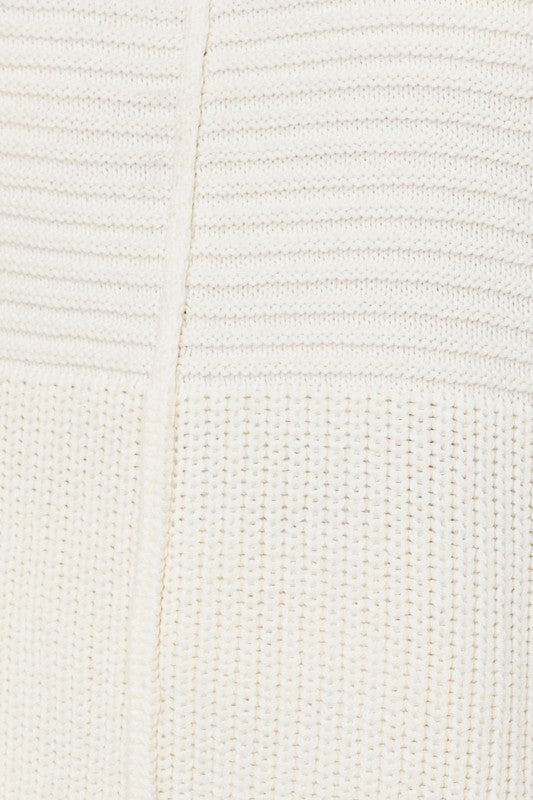 Close-up of a textured white fabric with a subtle pattern