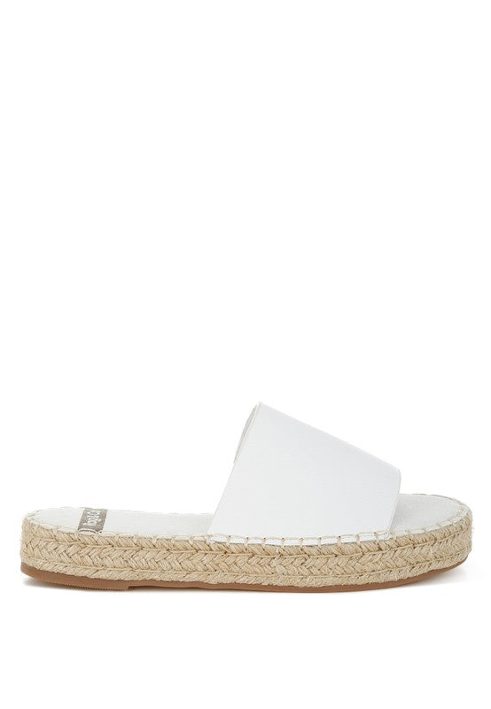White sandal with jute sole on a white background