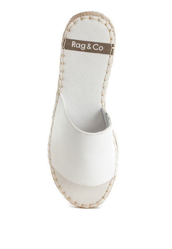 White sandal with beige sole and 'Rag & Co' label on a white background